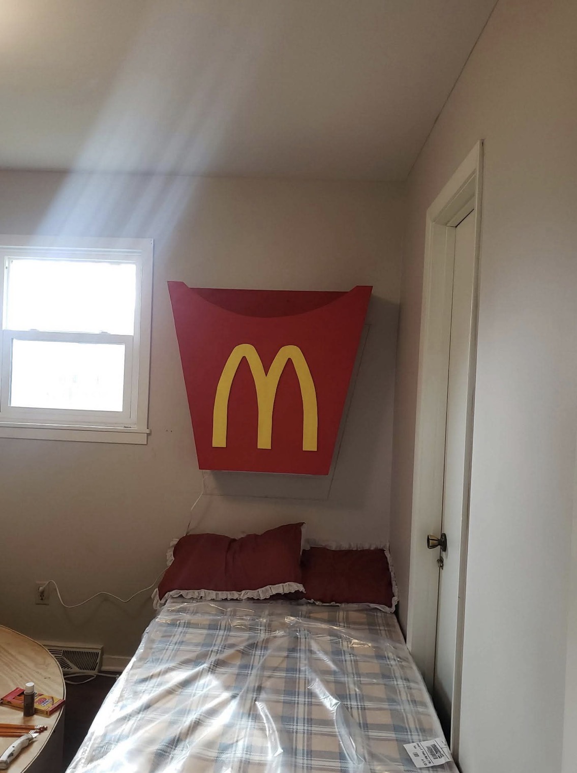 Custom hand-built oversized fry-box sign in a themed bedroom