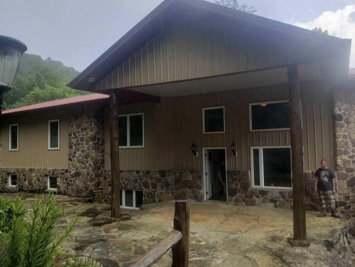 Exterior of a lake rental home with stone accents and covered porch